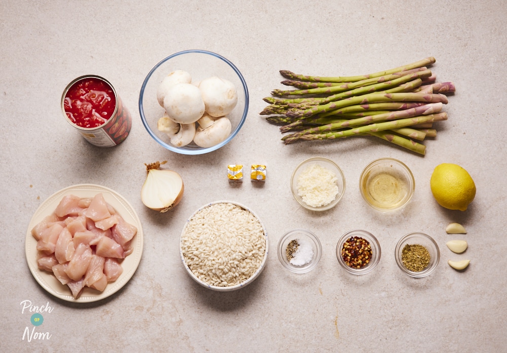 Ingredients for Spicy, Tomato Chicken and Asparagus Risotto laid out on counter.
