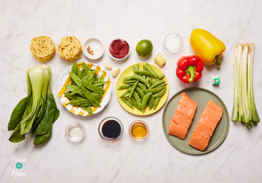 The ingredients for Pinch of Nom's slimming-friendly Teriyaki Chilli Salmon are laid out on a kitchen surface. Each ingredient is measured out, ready to begin cooking.