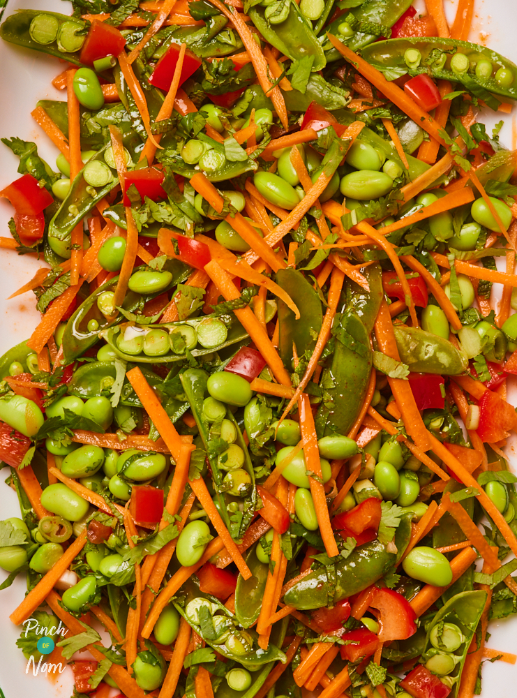 A close-up of Pinch of Nom's bright and colourful Edamame and Carrot Salad.