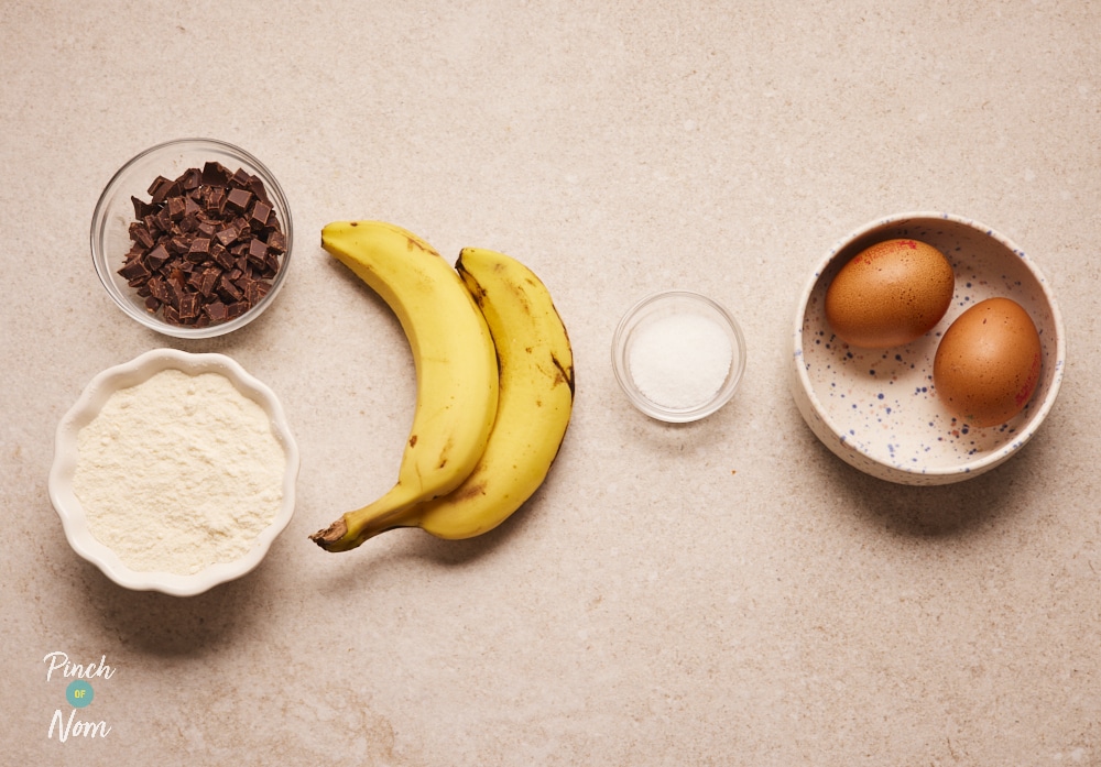 Ingredients for Pinch of Nom Coconut and Banana Chocolate Chip Cookies laid out on counter.