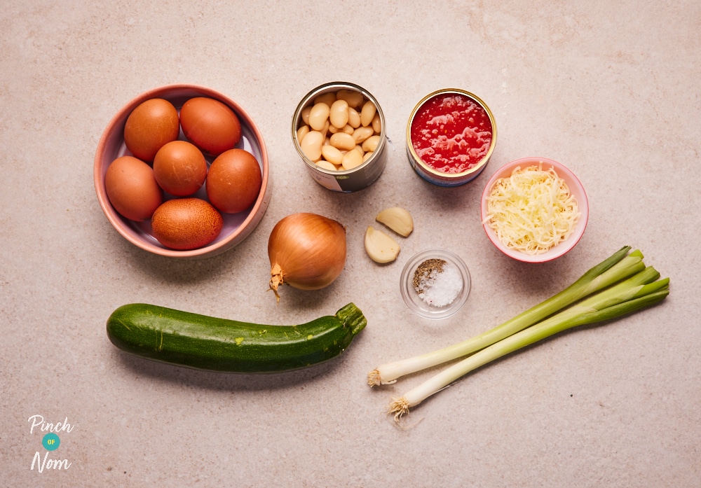 Ingredients for Pinch of Nom Courgette and Butter Bean Frittata laid out on counter.