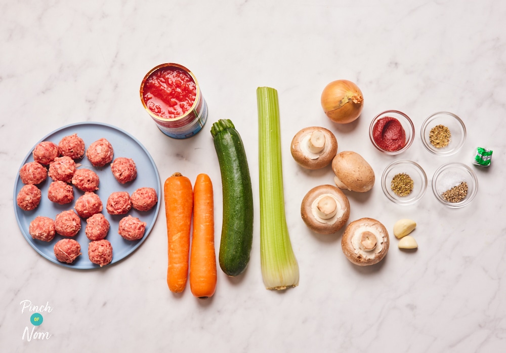 The ingredients for Pinch of Nom's slimming-friendly Meatball Marinara are laid out on a kitchen surface, ready to begin cooking.