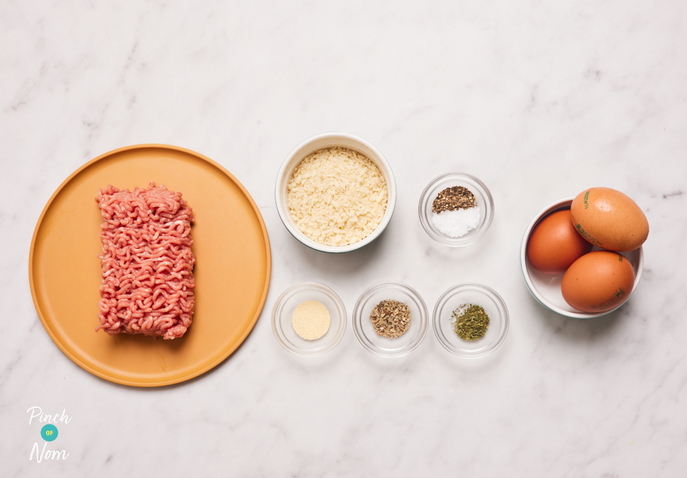 The ingredients for Pinch of Nom's slimming-friendly Scotch Eggs are laid out on a kitchen surface. Each ingredient is measured out, ready to begin cooking.