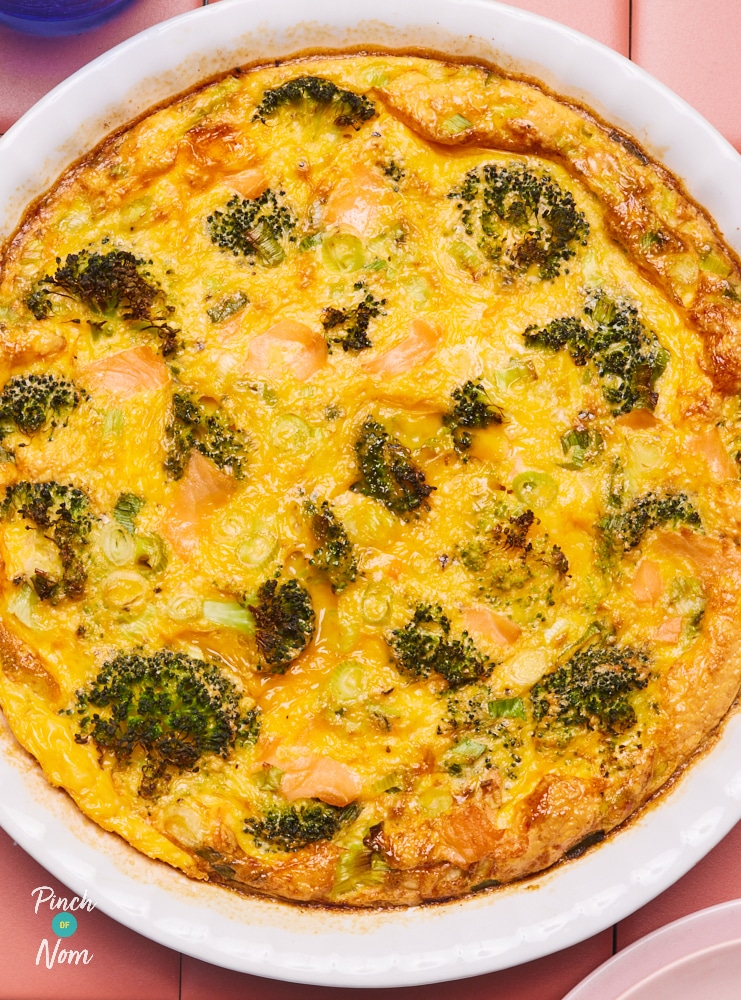 Pinch of Nom's slimming-friendly Smoked Salmon and Broccoli Quiche is served at the centre of a summery table