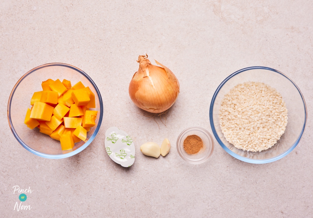 The ingredients for Pinch of Nom's Butternut Squash Risotto are laid out on a kitchen counter, ready to begin cooking.