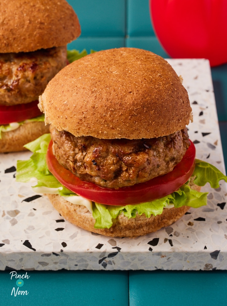 Pinch of Nom Pork and Apple Burgers, served on slimming-friendly buns with fresh salad.