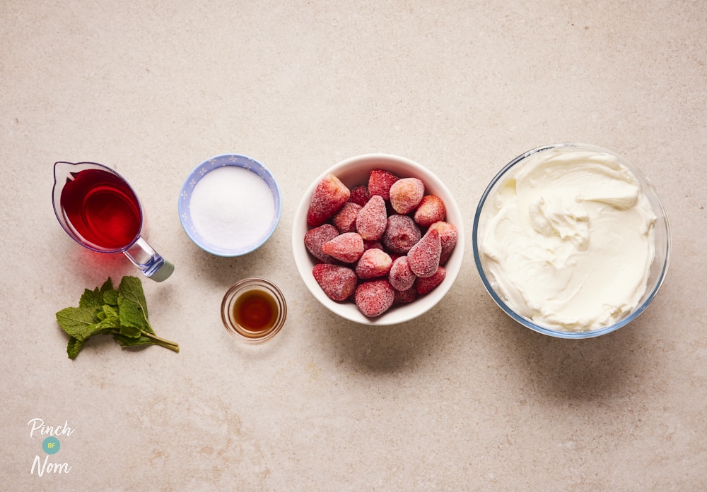 Ingredients for Strawberry Crush Frozen Yoghurt laid out on counter.