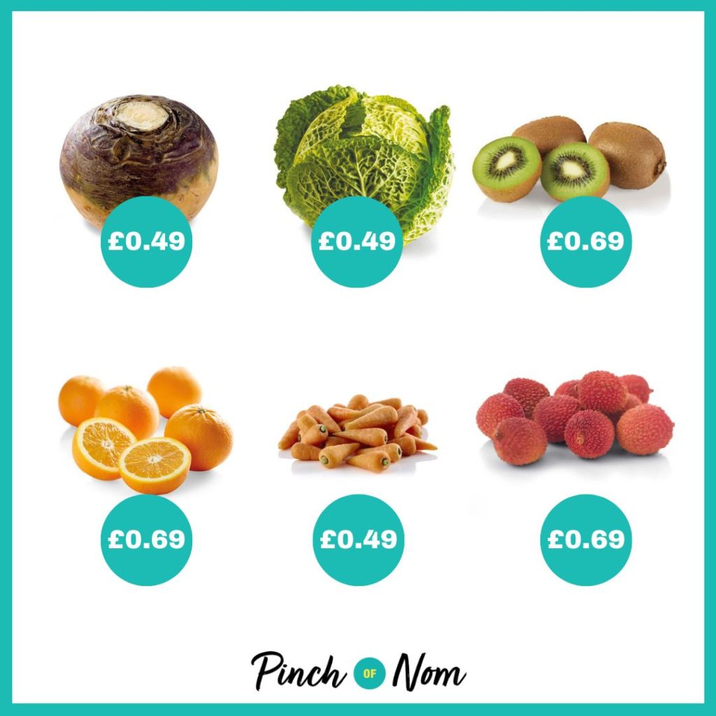 A white square image with a teal blue border, featuring the fruit and veg from Aldi's latest Super 6 selection. From left to right, there's swede, cabbage, kiwis, oranges, Chantenay carrots and lychees, all with the price tag in front of them in a teal blue circle. Swede is 49p, cabbage is 49, kiwis are 69p, oranges are 69p, Chantenay carrots are 49p, lychees are 69p.