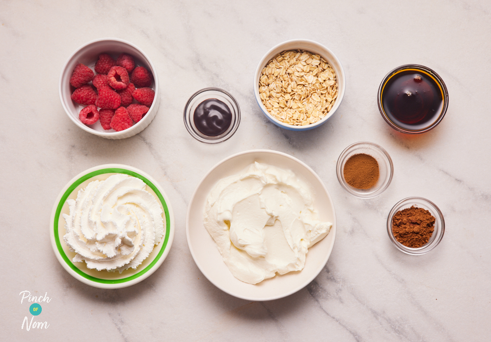 The ingredients for Pinch of Nom's Raspberry Mocha Granola Pots are laid out on a kitchen counter, ready to start cooking.