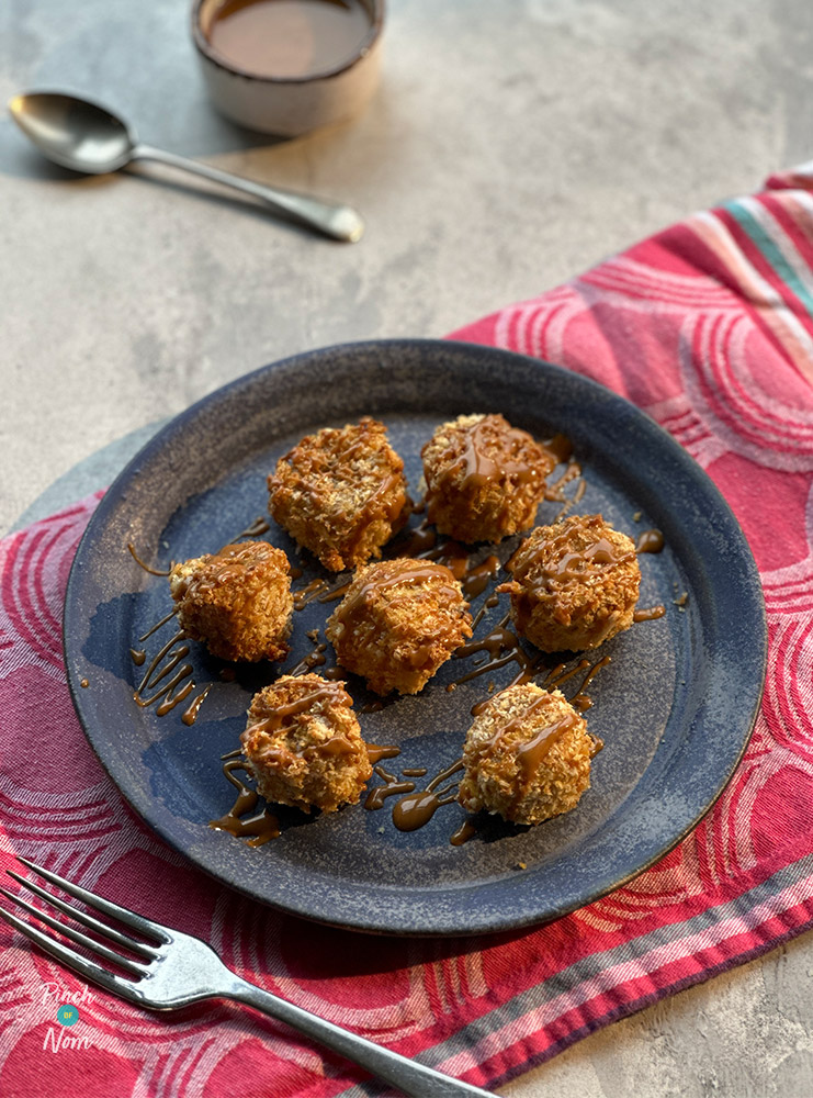 A plate is filled with Pinch of Nom's slimming-friendly Air Fryer Biscoff Banana Bites from the Air Fryer cookbook.