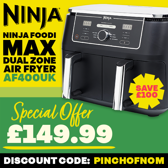 A banner advertising that Pinch of Nom has teamed up with Ninja to save £100 on the Ninja Foodi MAX Dual Zone Air Fryer AF400UK with text that reads 'SPECIAL OFFER £149.99' and 'DISCOUNT CODE: PINCHOFNOM' and 'CLICK HERE TO BUY NOW'.