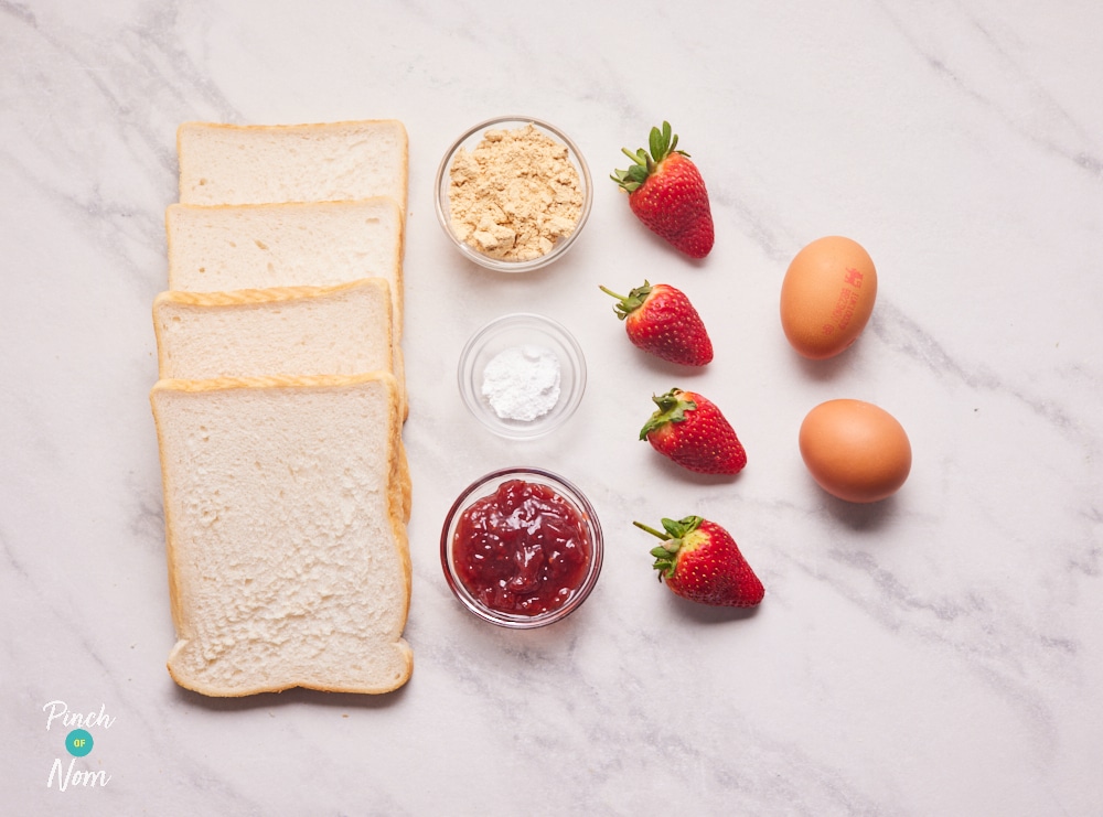 The ingredients for Pinch of Nom's Peanut Butter ad Jelly French Toast are laid out on a kitchen counter.
