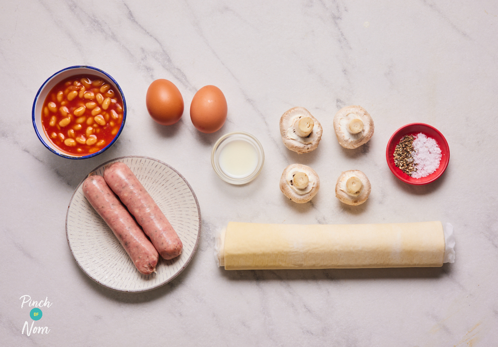 The ingredients for Pinch of Nom's Full English Pinwheels are set out on a kitchen counter, ready to begin cooking.