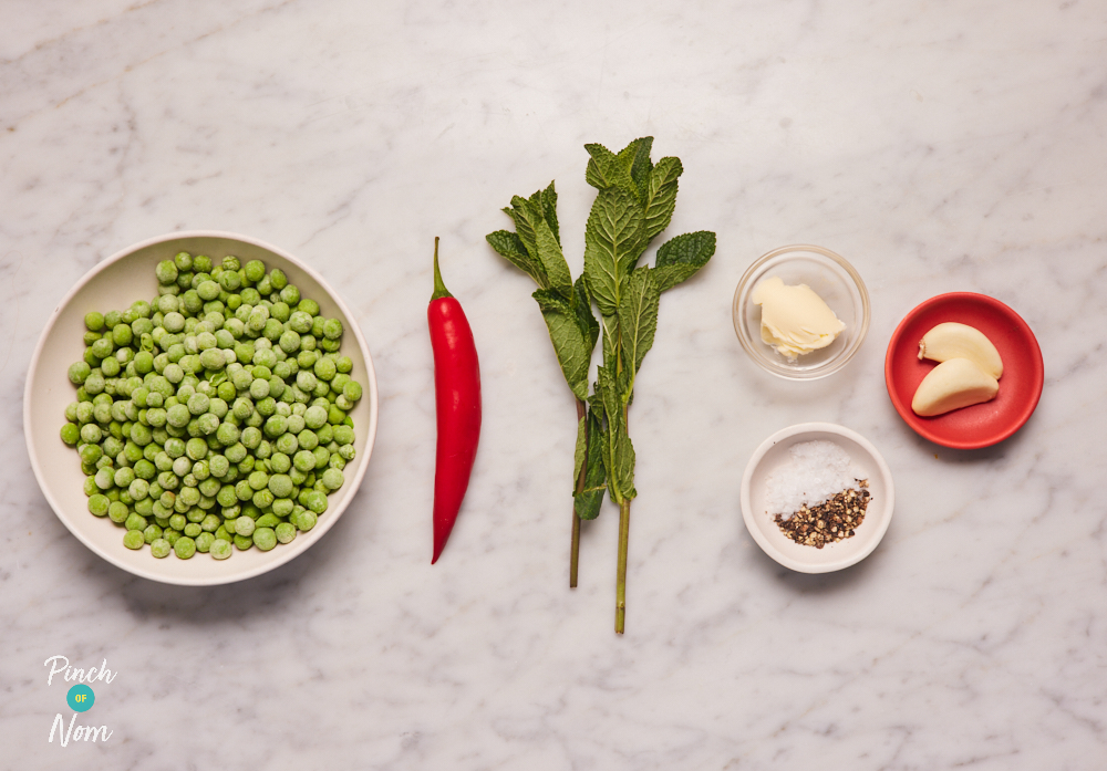 The ingredients for Pinch of Nom's Chilli and Mint Peas are laid out on a kitchen counter, ready to begin cooking.