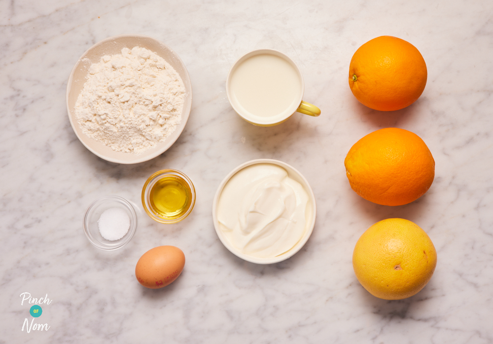 The ingredients for Pinch of Nom's Sunshine Waffles are laid out on a kitchen counter, ready to begin cooking.