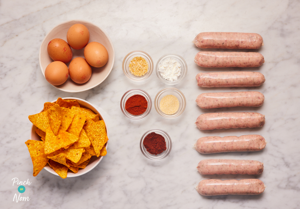 The ingredients for Pinch of Nom's Zinger Scotch Eggs are laid out on a kitchen countertop. Each ingredient is weighed out in a separate container, ready to begin cooking.