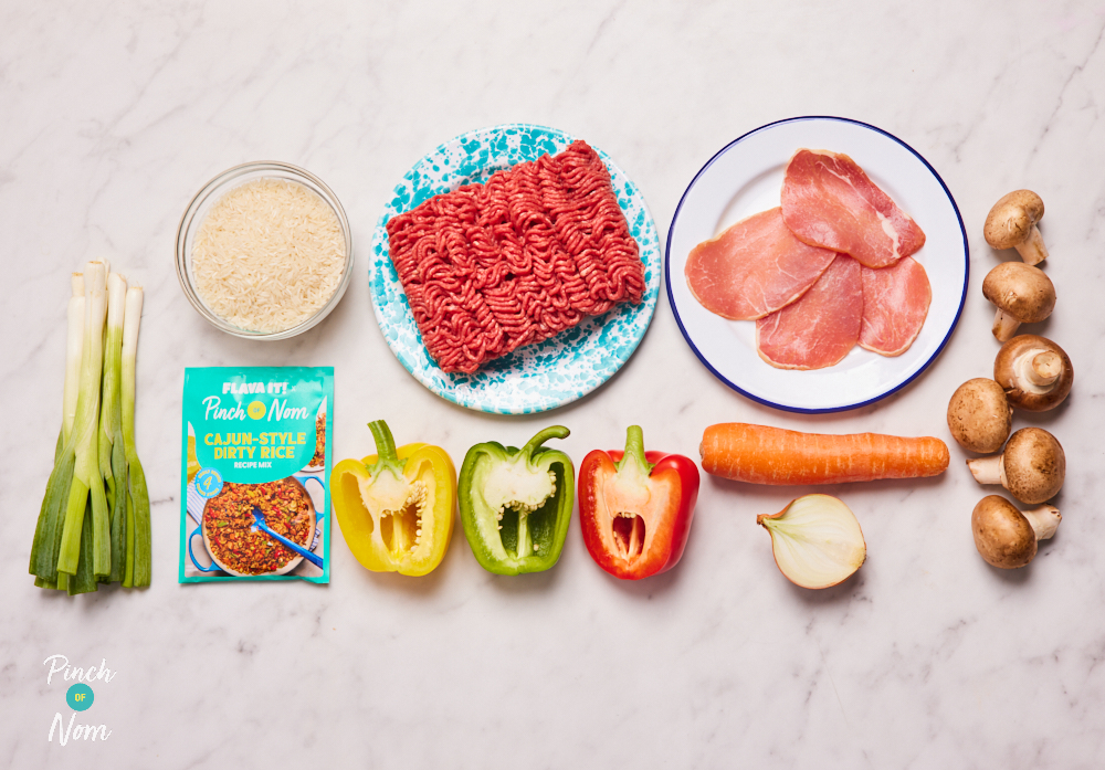 The ingredients for Pinch of Nom X Flava It! Cajun-Style Dirty Rice are laid out on a kitchen surface, ready to begin cooking.