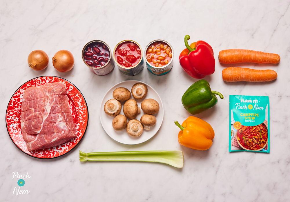 The ingredients for Pinch of Nom X Flava It! Campfire Stew are laid out on a kitchen surface, ready to begin cooking.