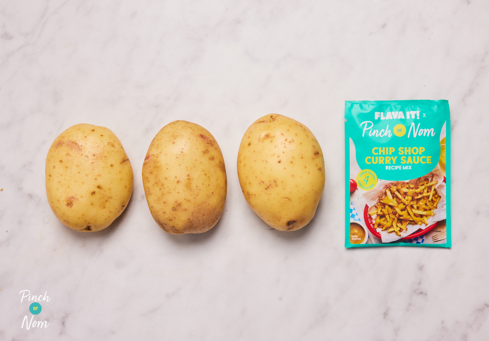 The ingredients for Pinch of Nom X Flava It! Chip Shop Curry Sauce are laid out on a kitchen surface, ready to begin cooking.