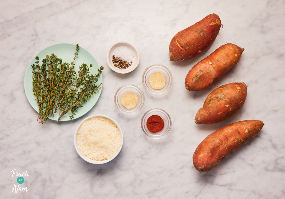 The ingredients for Pinch of Nom's Garlic and Parmesan Sweet Potatoes are laid out on a kitchen surface. Each ingredient is weighed out in a separate container, ready to begin cooking.