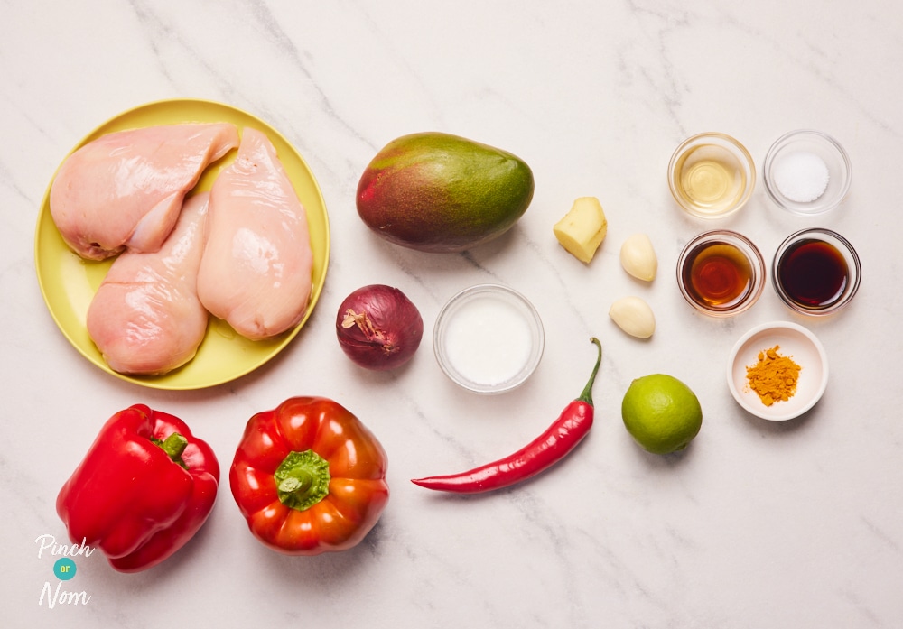 The ingredients for Pinch of Nom's Mango Chilli Chicken are laid out on a kitchen surface, ready to begin cooking.