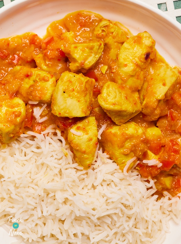 A close up shows Pinch of Nom's Mango Chilli Chicken, served with a portion of basmati rice.