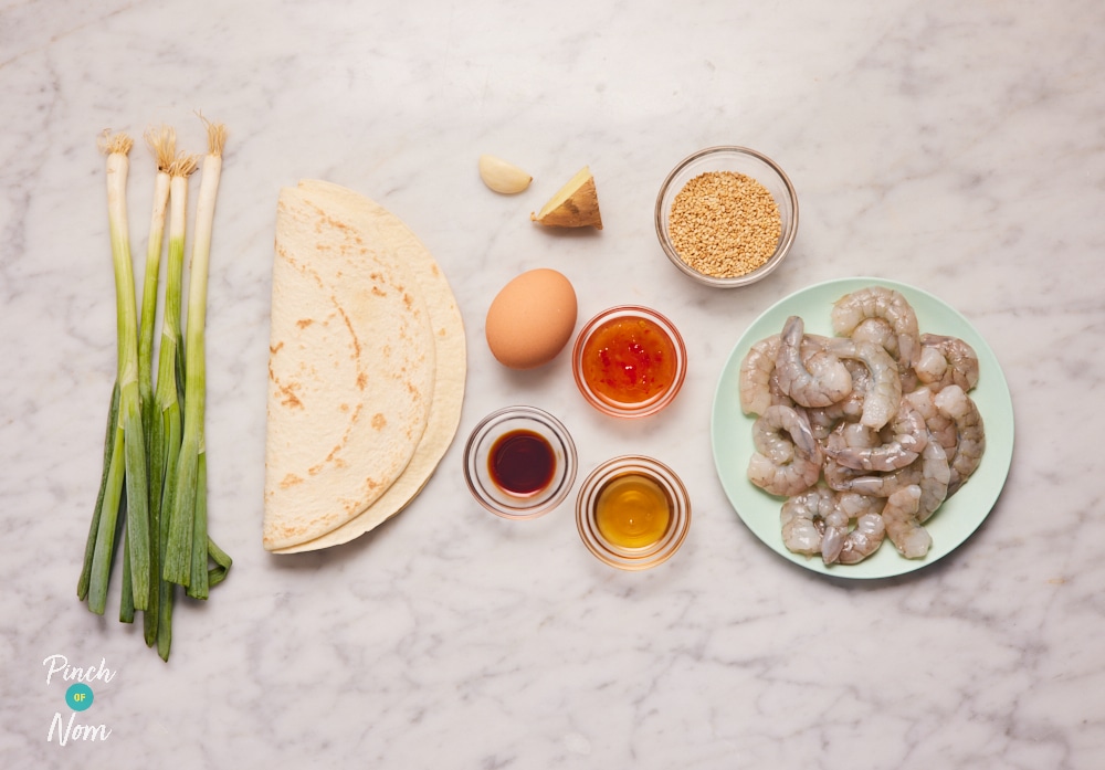 The ingredients for Pinch of Nom's Prawn Bites are laid out on a kitchen countertop, ready to begin cooking.