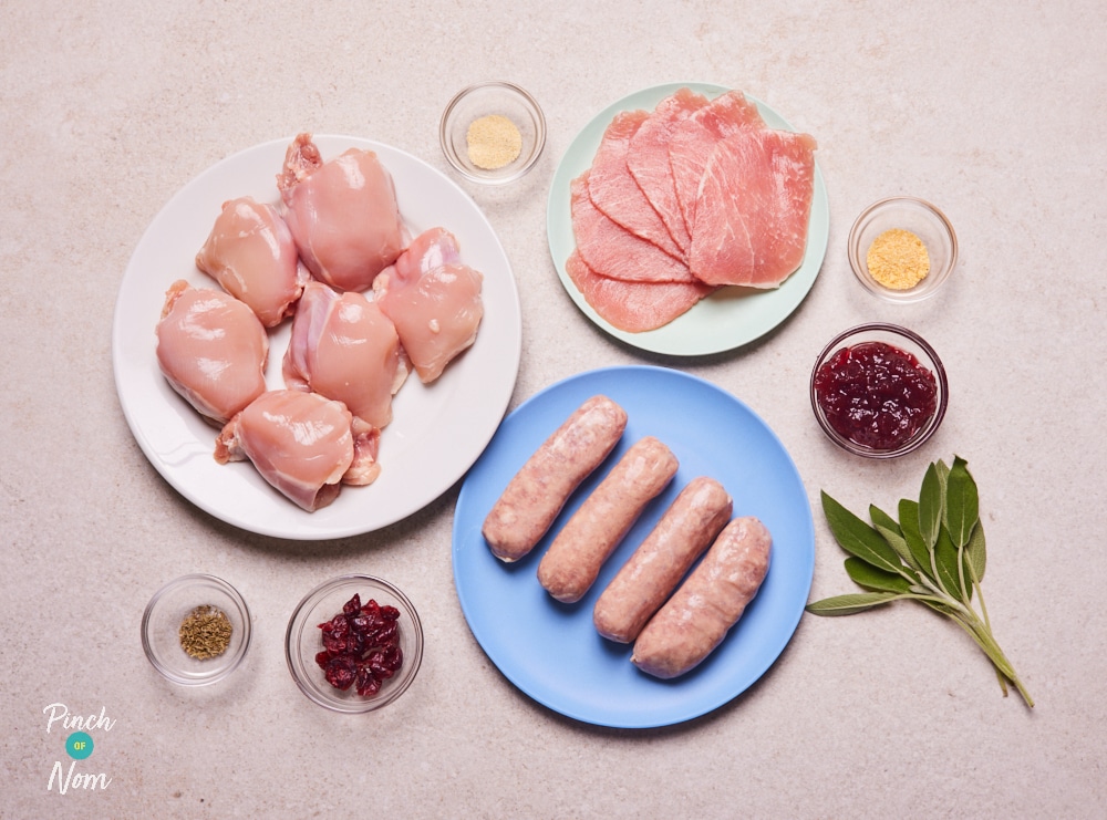 The ingredients for Pinch of Nom's Christmas Chicken Thighs are laid out on a kitchen counter, ready to begin cooking.