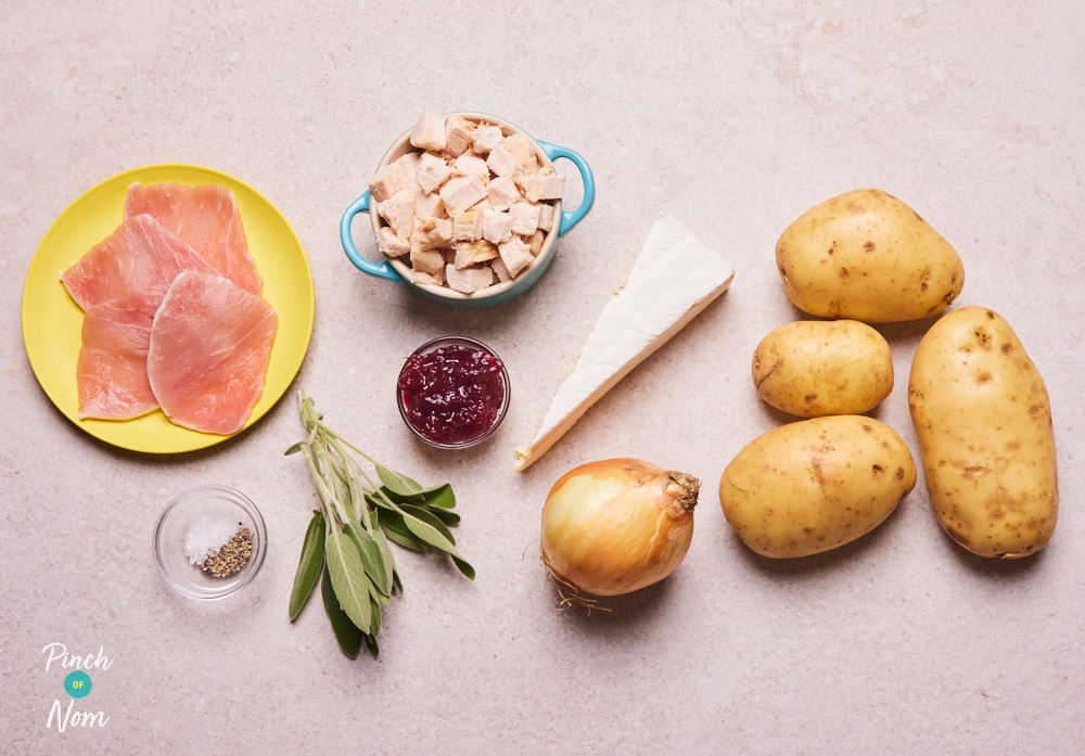 The ingredients for Pinch of Nom's Christmas Loaded Fries are laid out on a kitchen surface, ready to begin cooking.