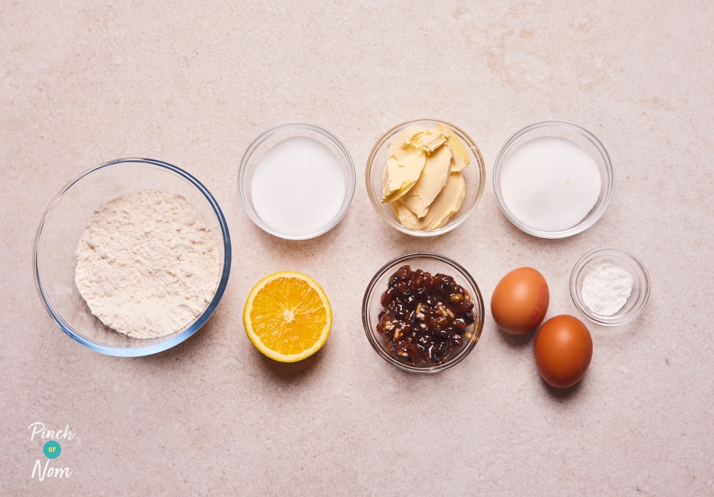 The ingredients for Pinch of Nom's Mince Pie Pudding are laid out on a kitchen counter, ready to begin cooking.