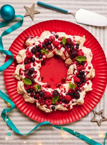 A close up photograph of Pinch of Nom’s slimming-friendly Pavlova Wreath recipe.