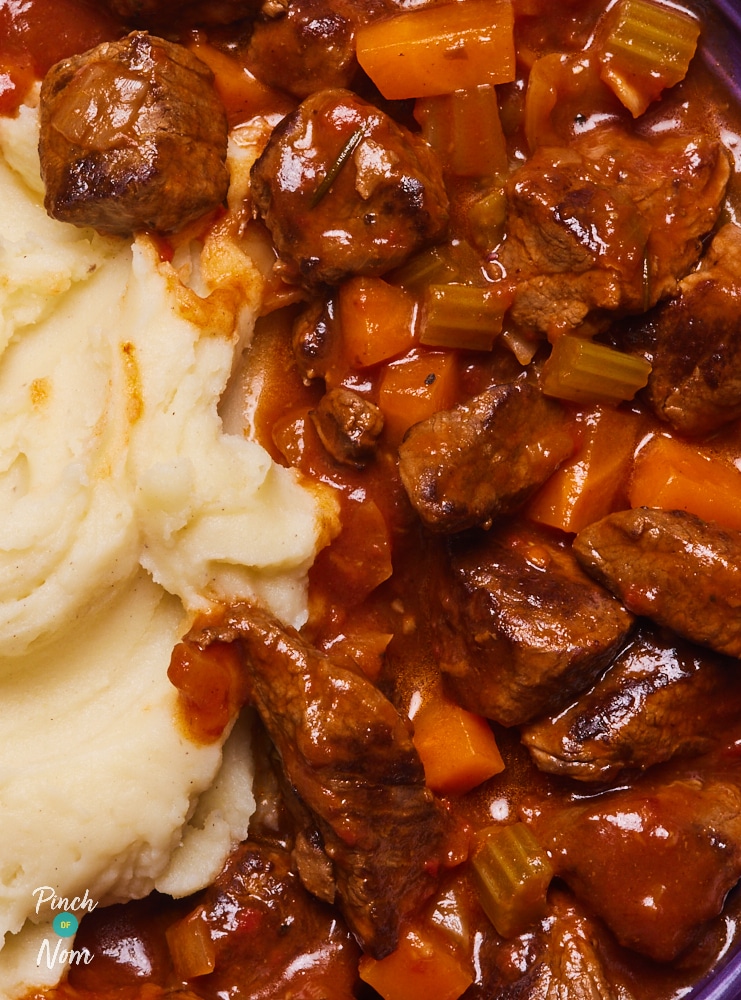 A close-up of Pinch of Nom's Mulled Wine Beef Stew, served with creamy mashed potatoes.