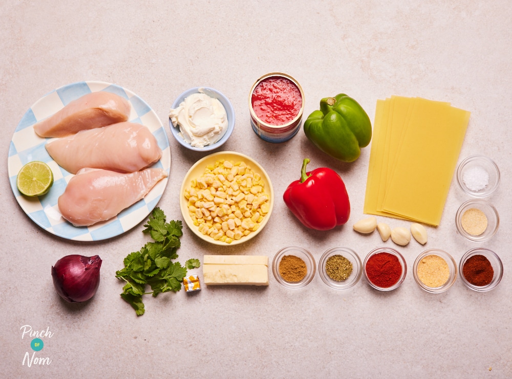 The ingredients for Pinch of Nom's Chicken Fajita Lasagne are laid out on a kitchen counter, ready to begin cooking.