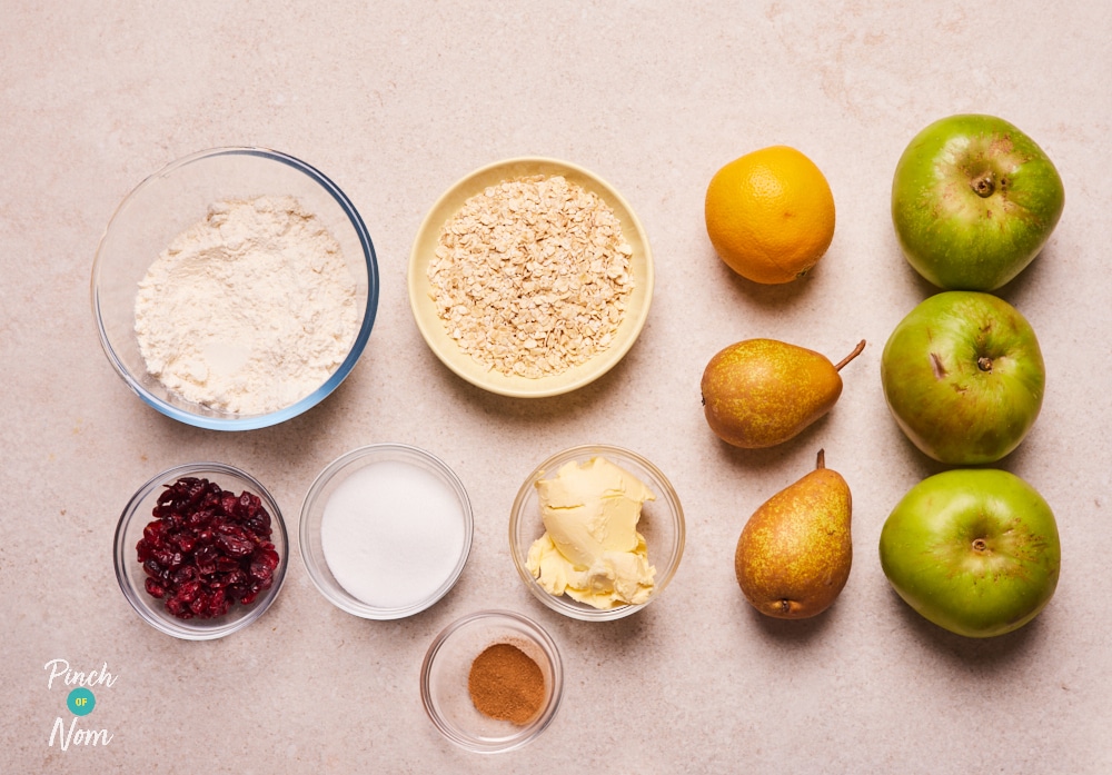 The ingredients for Pinch of Nom's Christmas Crumble are paid out on a kitchen counter, ready to begin cooking.