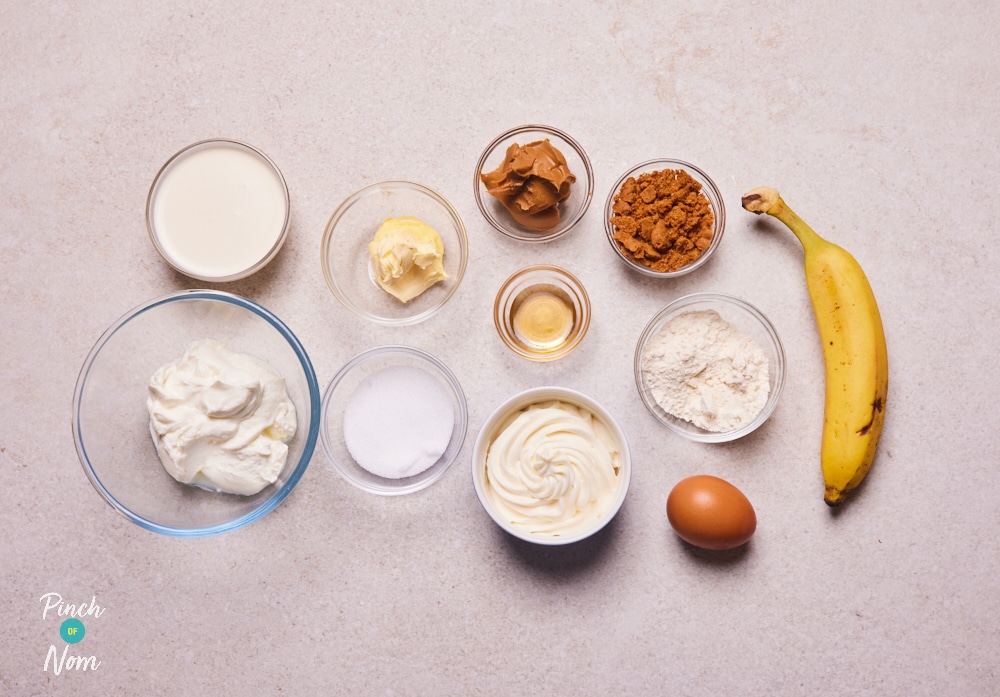 The ingredients for Pinch of Nom's Biscoff Trifles are laid out on a kitchen counter, ready to begin baking.