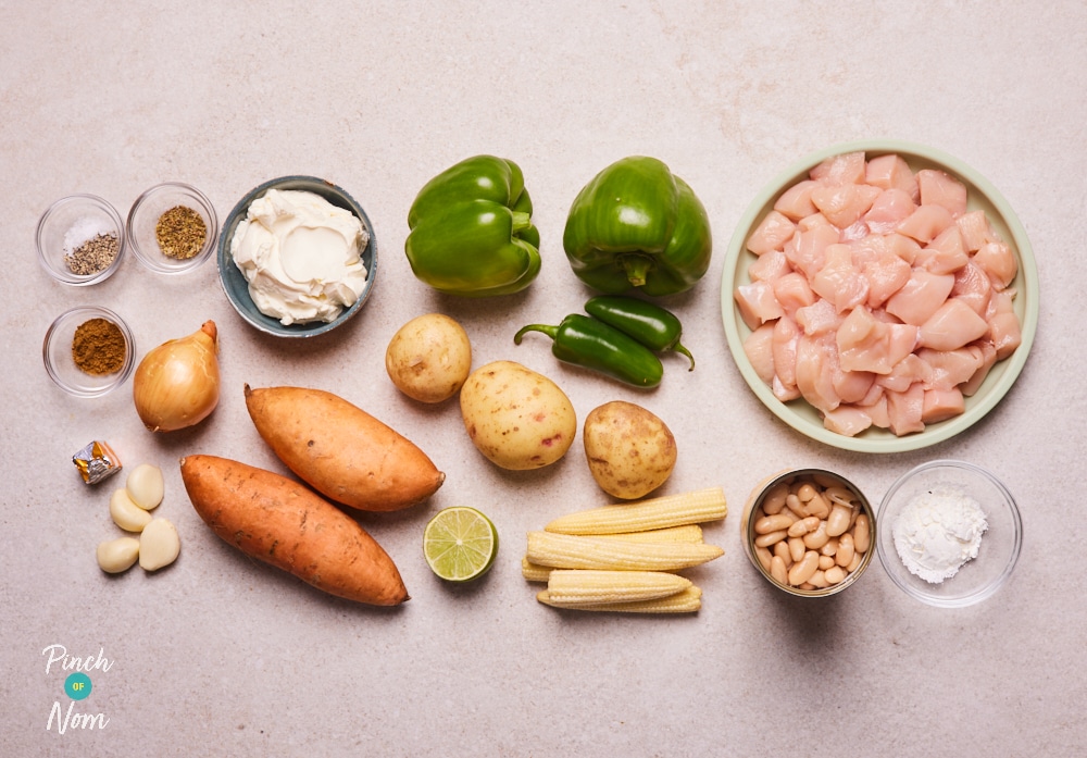 The ingredients for Pinch of Nom's Chilli Chicken Pie with Sweet Potato Topping are laid out on a kitchen counter, ready to begin cooking.