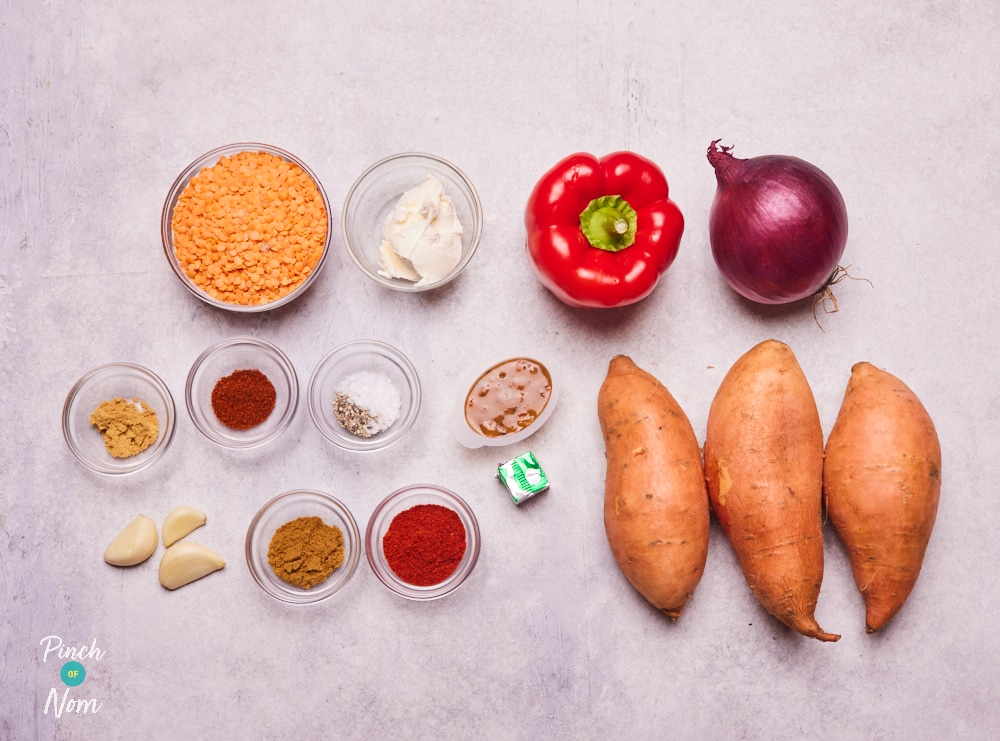 The ingredients for Pinch of Nom's Sweet Potato and Red Lentil Soup are laid out on a kitchen counter, ready to begin cooking.