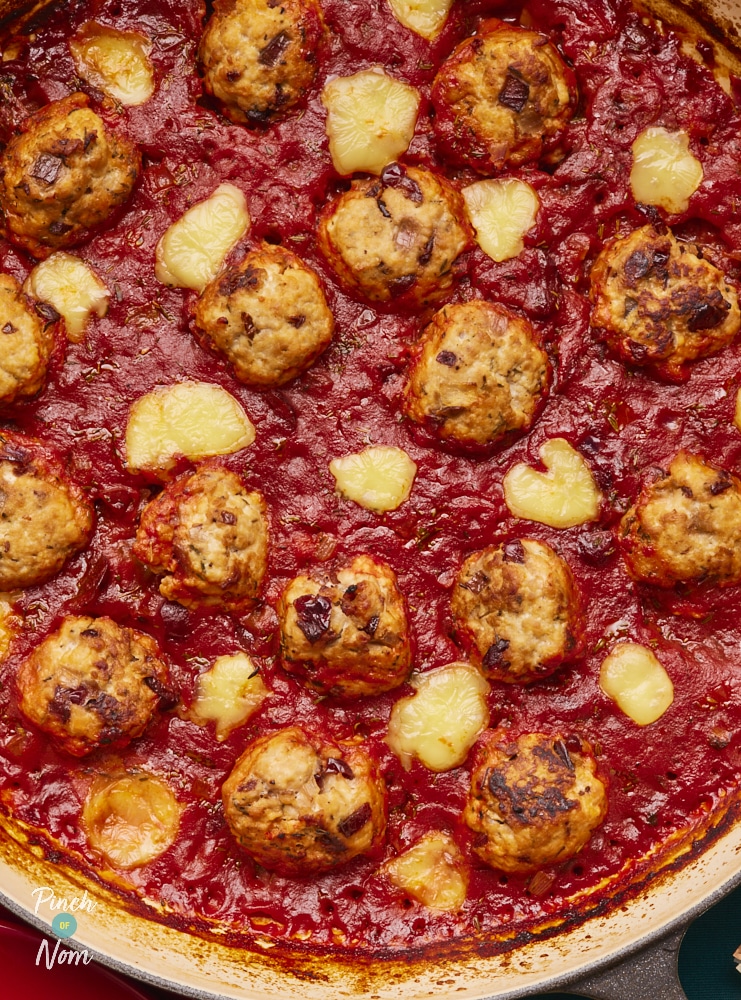 Brie and Cranberry Meatballs, cooked in sauce, ready for serving.
