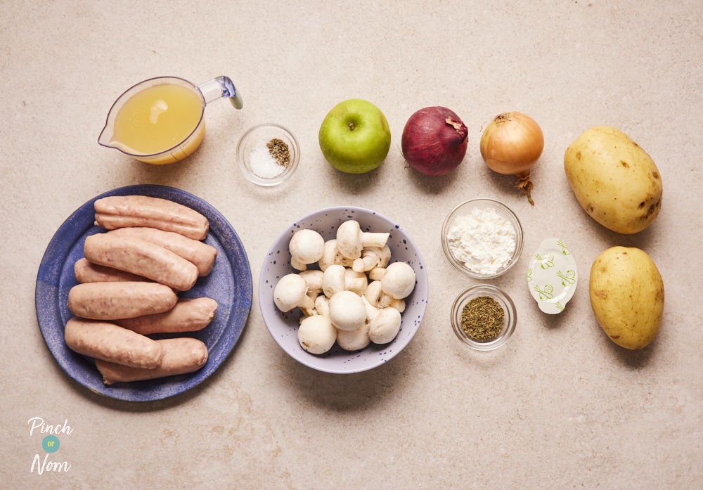 Sausage and Onion Hotpot ingredients laid out on counter.