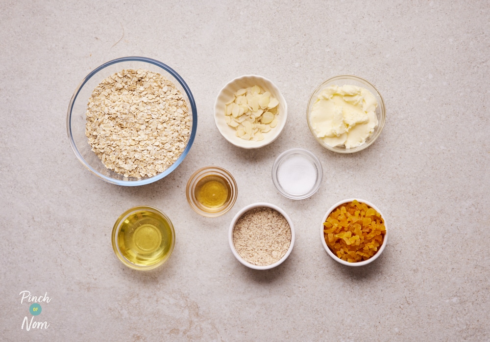 Ingredients for Apricot and Almond Oat Bars laid out on counter.